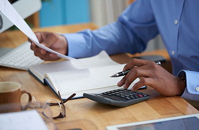 Professional using a calculator
