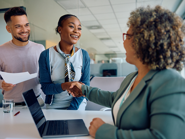 Two people meet with a financial professional