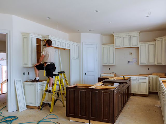 Person working on a kitchen remodel